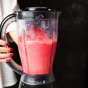 nutribullet pro 900 blender woman holding blender red smoothie